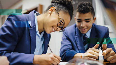 students talking at desk