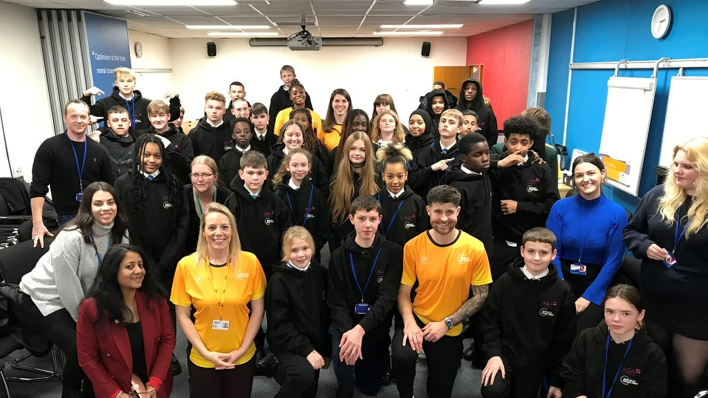 Students gathered for a group photo in AQA's Guildford offices at the Unlocking Potential event