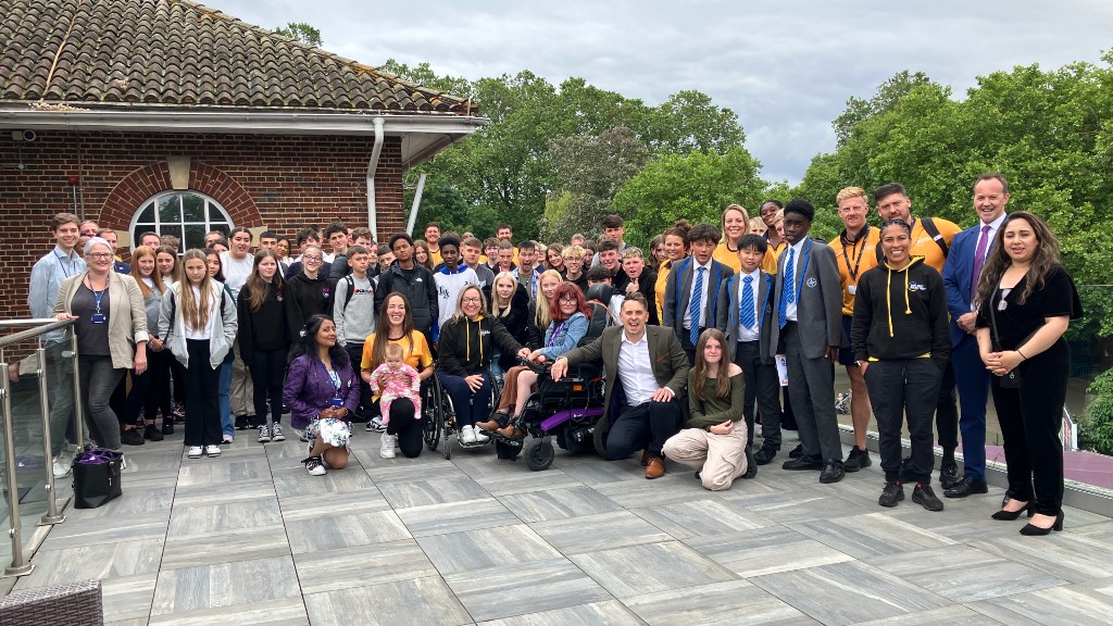 Final group photo of all AQA Unlocking Potential students, athlete mentors and AQA volunteers